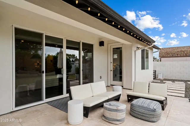 a outdoor living space with furniture and a potted plant