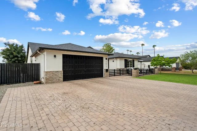 a house with yard in front of it