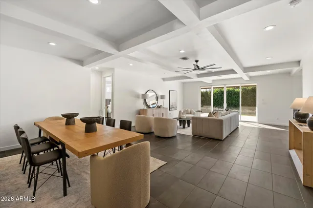 a living room with furniture a table and chairs
