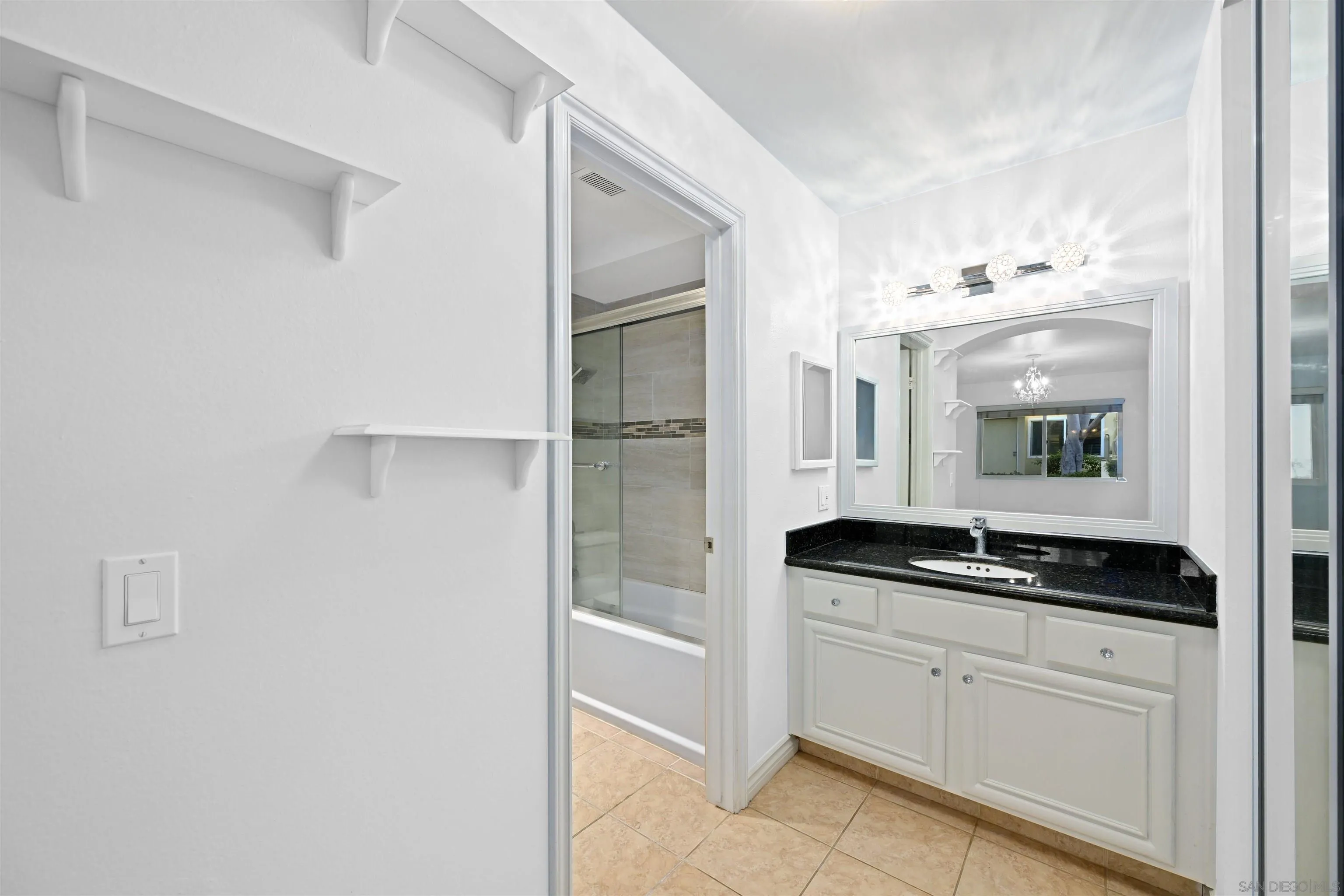9939 Erma Road, Unit 101 San Diego, CA 92131 - Photo 12 of 24 a kitchen with a sink and cabinets