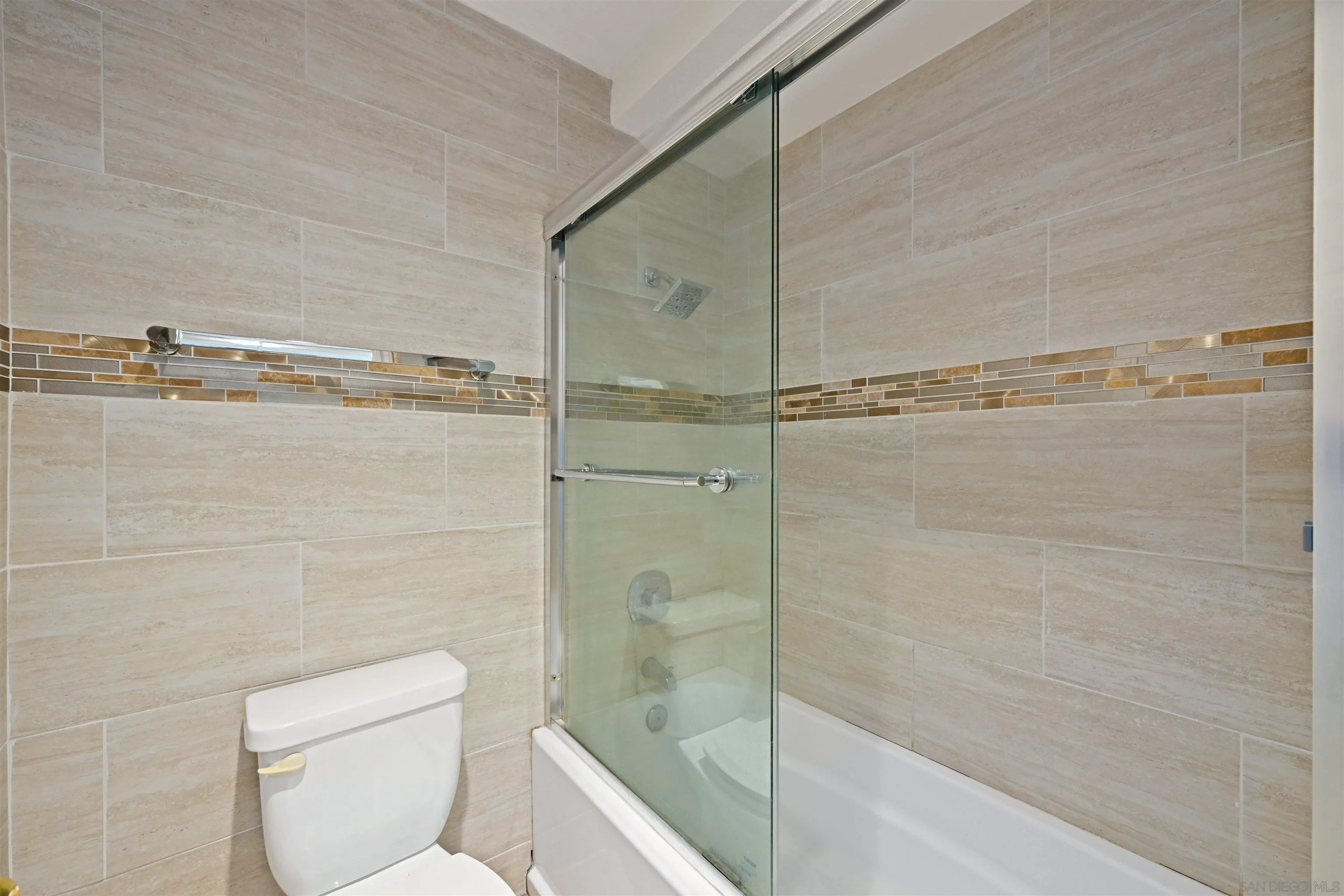 9939 Erma Road, Unit 101 San Diego, CA 92131 - Photo 13 of 24 a bathroom with a shower and toilet