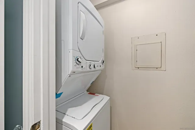 a balcony with table and chairs