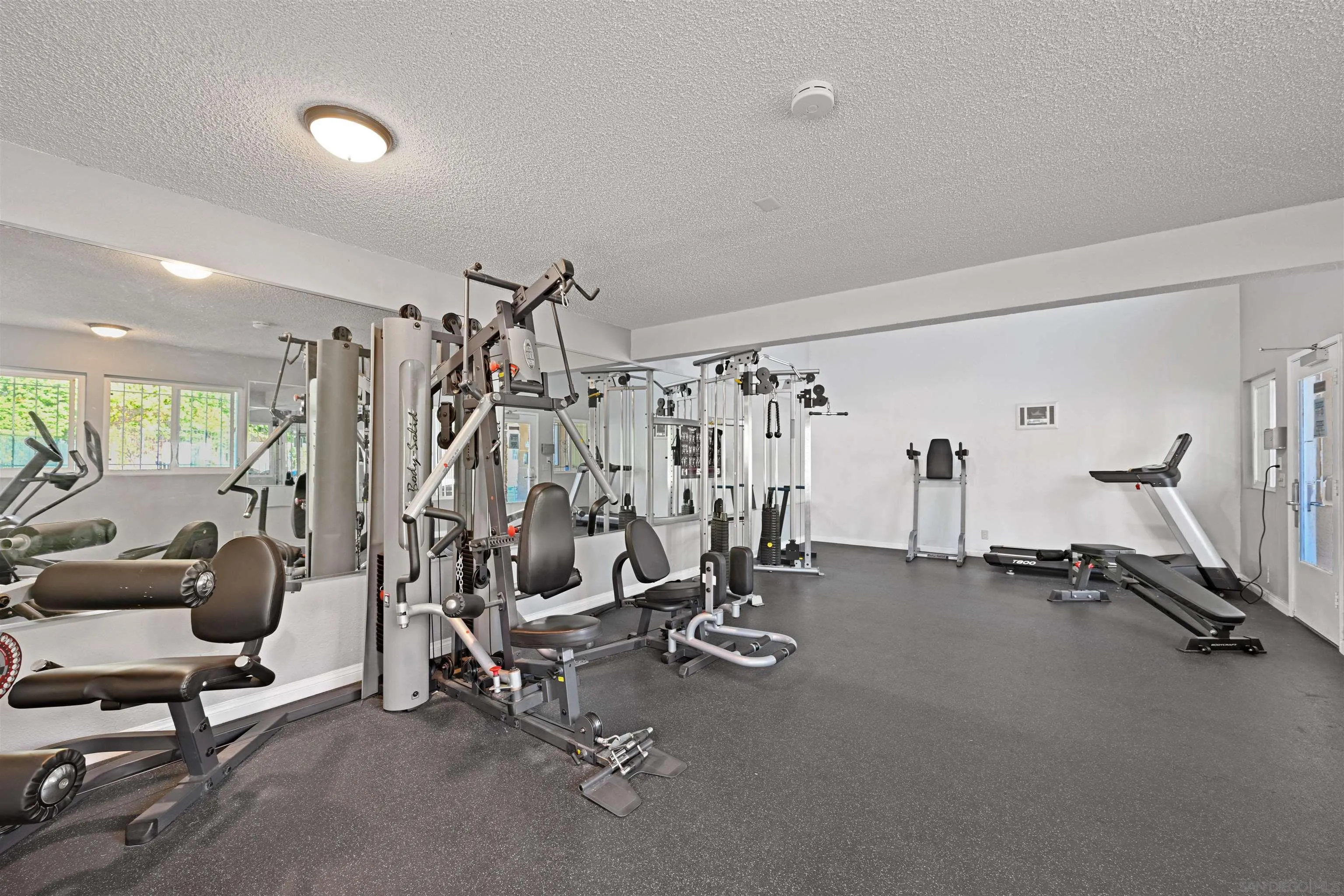 9939 Erma Road, Unit 101 San Diego, CA 92131 - Photo 21 of 24 a view of a room with gym equipment