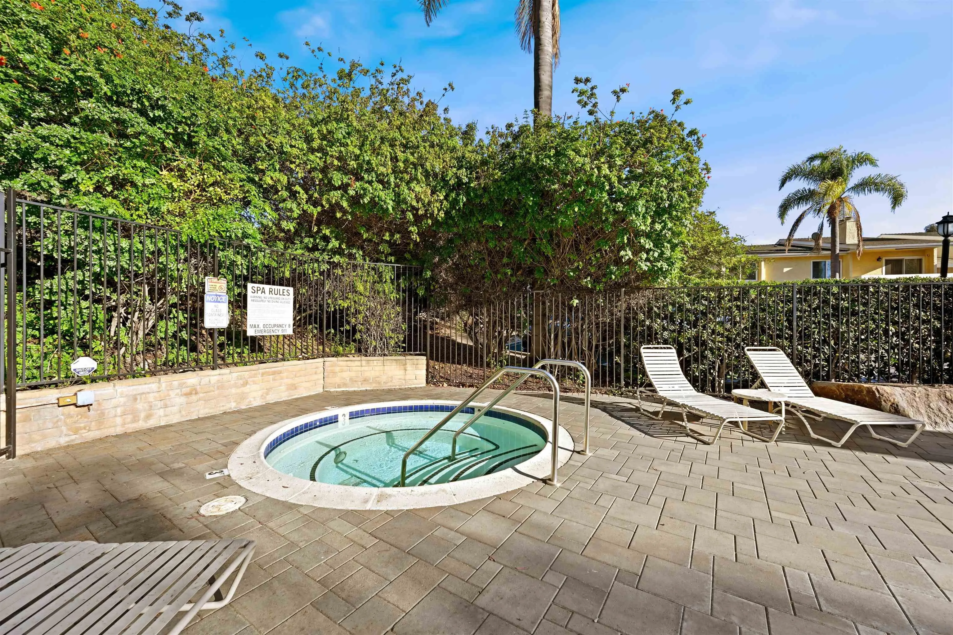 9939 Erma Road, Unit 101 San Diego, CA 92131 - Photo 24 of 24 a view of a swimming pool with a patio