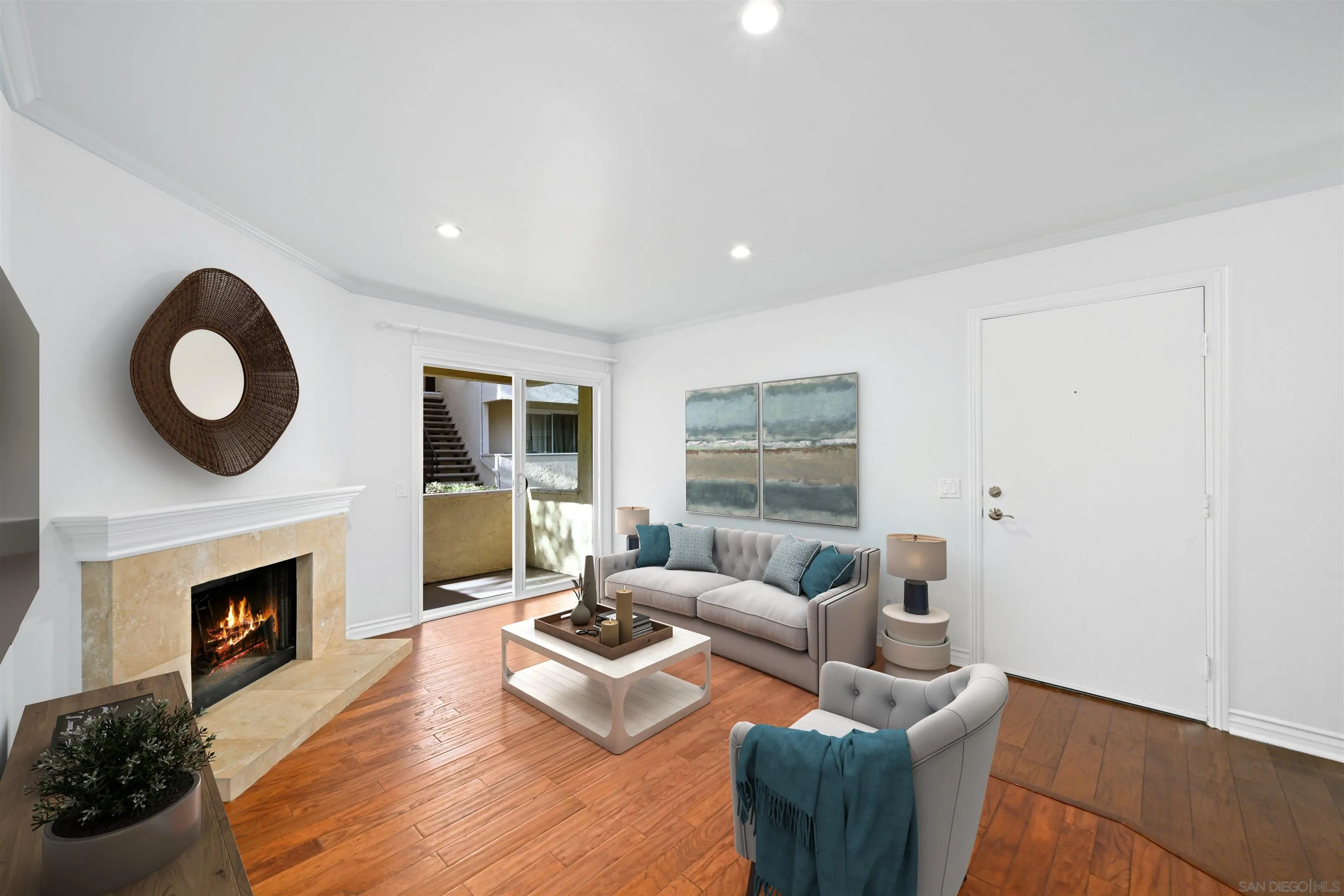 9939 Erma Road, Unit 101 San Diego, CA 92131 - Photo 3 of 24 a living room with furniture and a fireplace