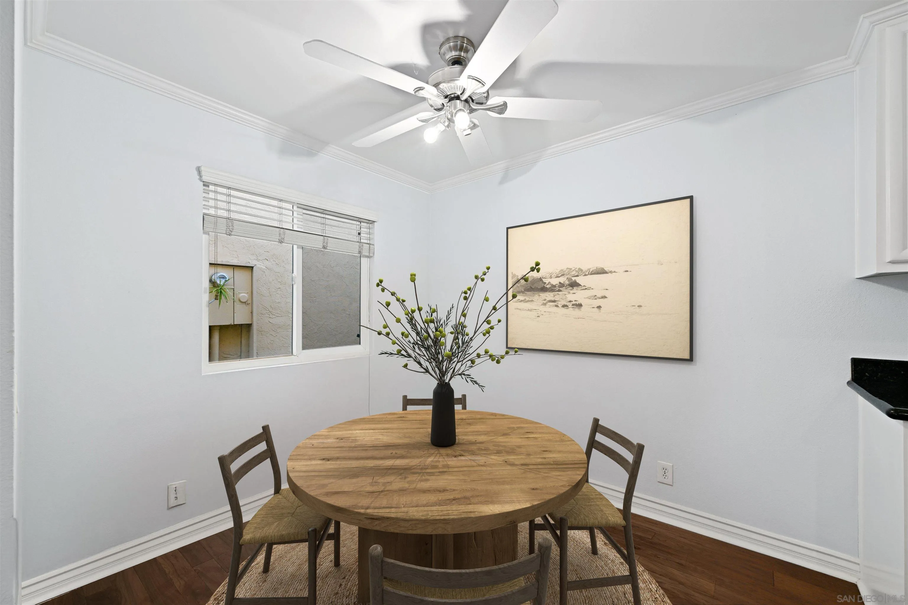 9939 Erma Road, Unit 101 San Diego, CA 92131 - Photo 6 of 24 a view of a dining room with furniture and wooden floor
