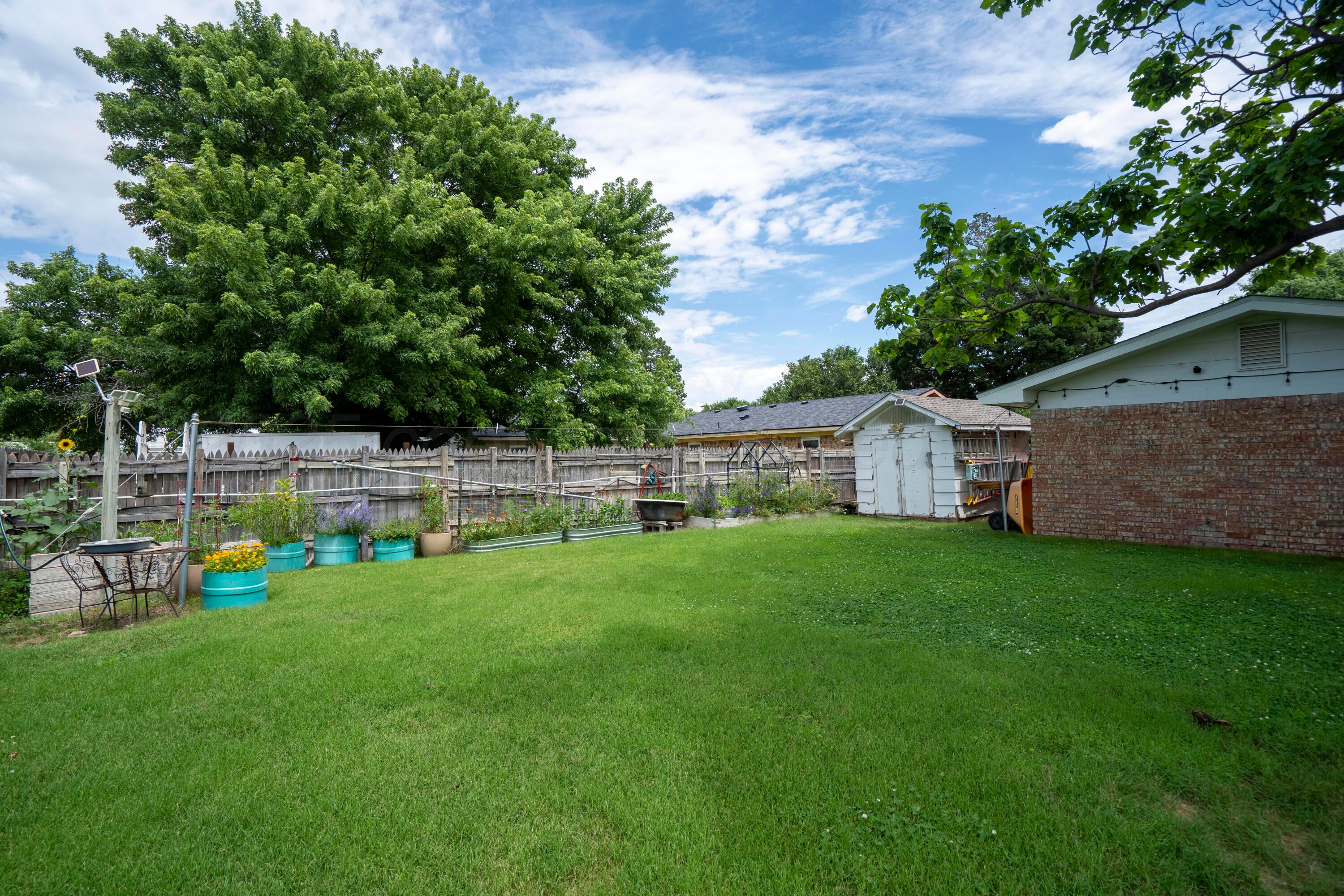 314 Overland Trail Fritch, TX 79036 - Photo 33 of 36 a view of a backyard with sitting area