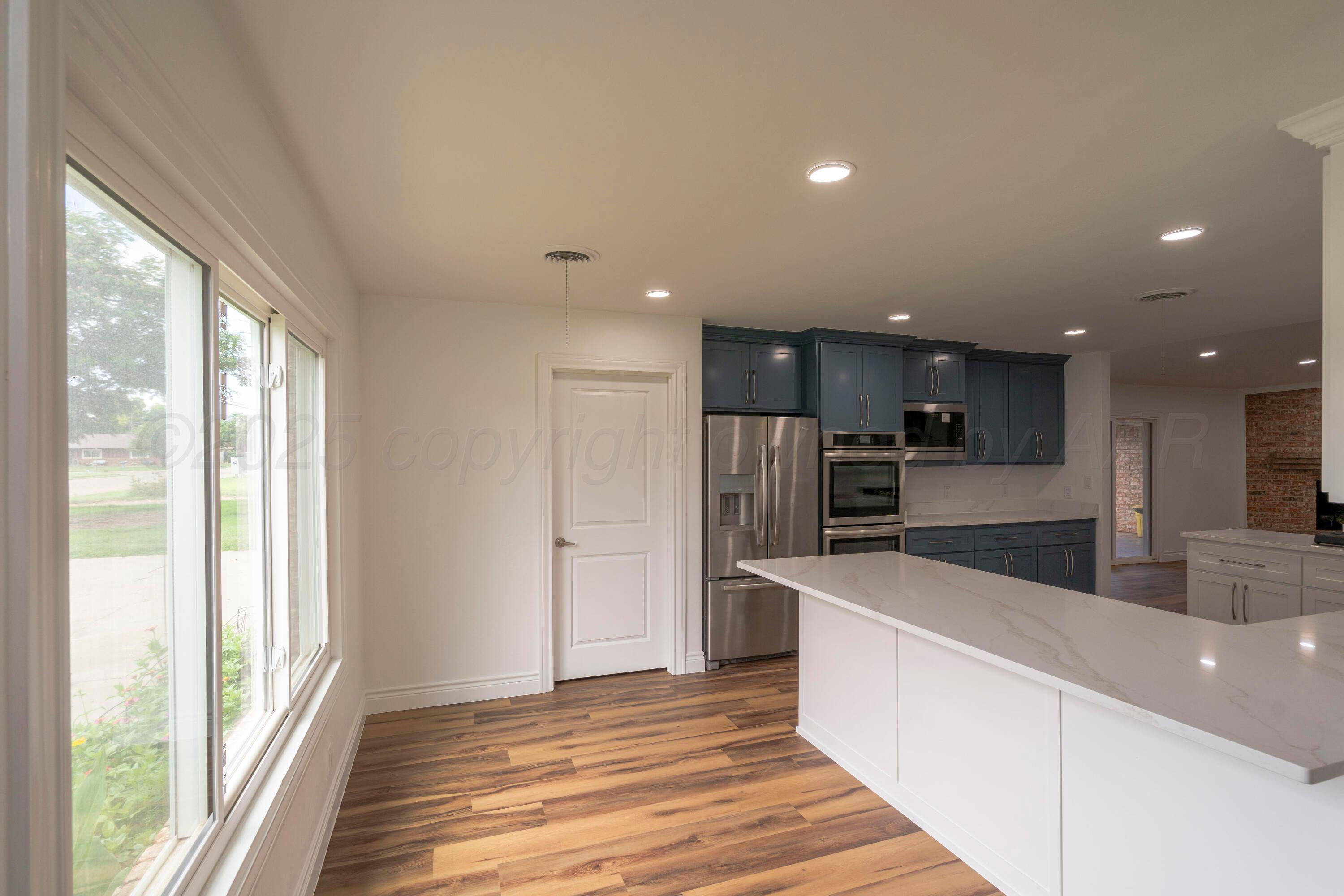 314 Overland Trail Fritch, TX 79036 - Photo 9 of 36 a kitchen with stainless steel appliances a refrigerator and a sink