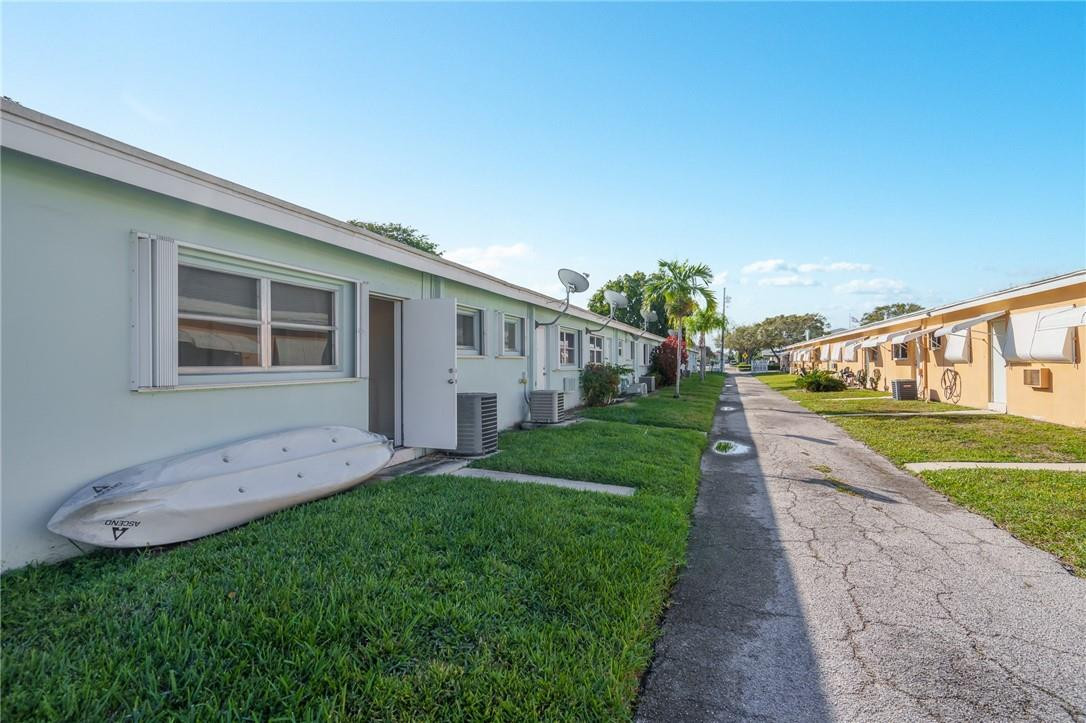 3801 Northeast 22nd Terrace, Unit 12A Lighthouse Point, FL 33064 - Photo 21 of 34 a view of a house with a yard
