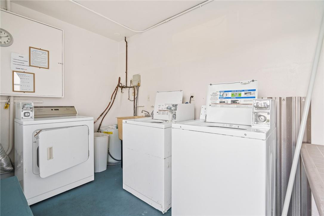 3801 Northeast 22nd Terrace, Unit 12A Lighthouse Point, FL 33064 - Photo 23 of 34 a utility room with dryer and washer