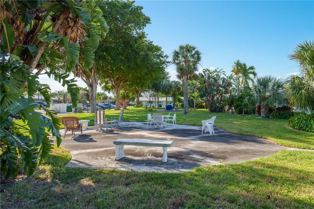 3801 Northeast 22nd Terrace, Unit 12A Lighthouse Point, FL 33064 - Photo 29 of 34 a view of yard with swimming pool and green space