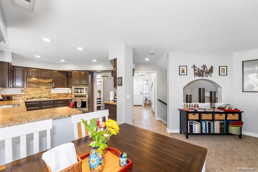 1840 Century Way Escondido, CA 92026 - Photo 12 of 36 a living room with furniture and a kitchen view