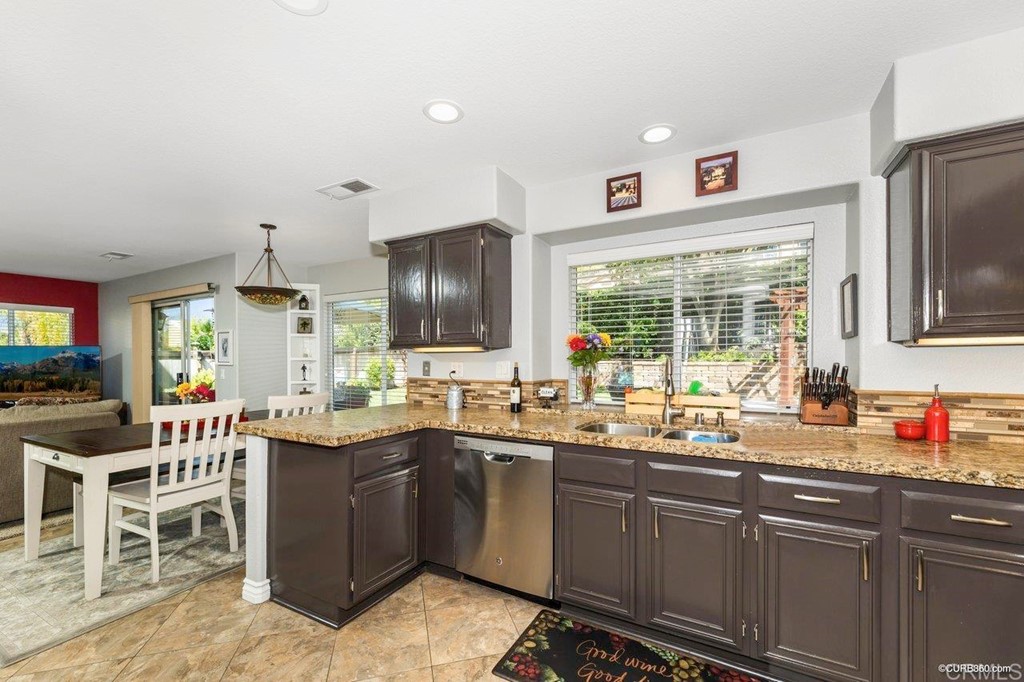 1840 Century Way Escondido, CA 92026 - Photo 14 of 36 a kitchen with lots of counter top space sink and window