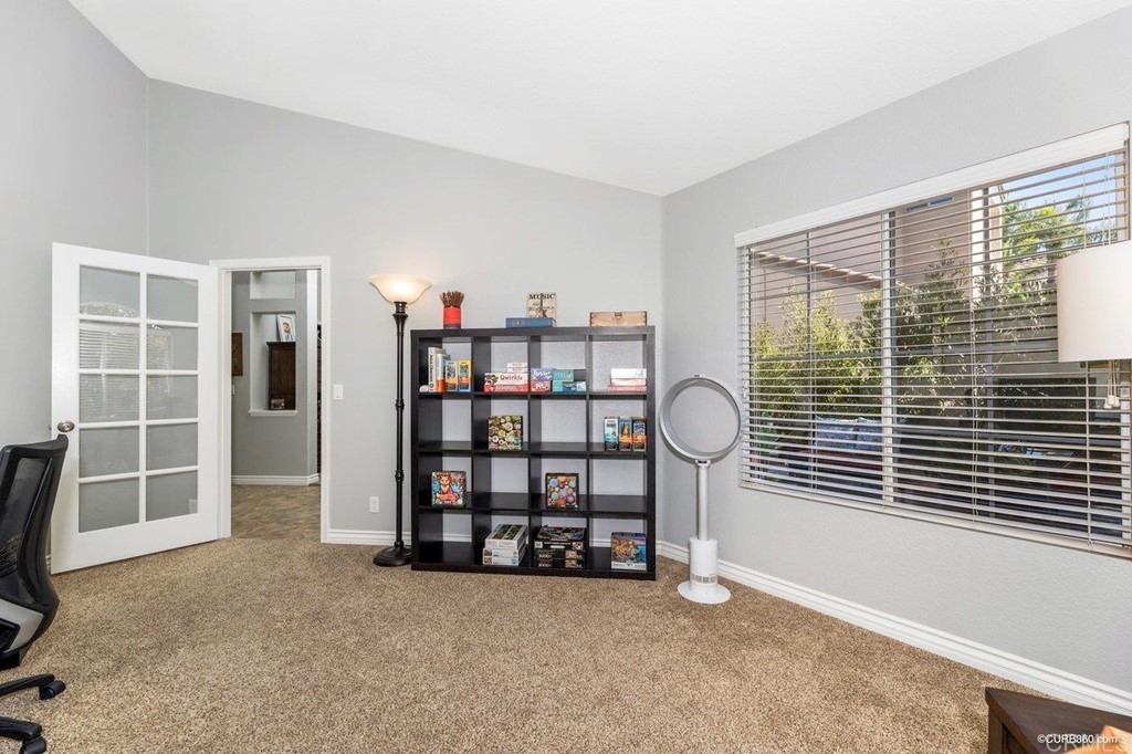 1840 Century Way Escondido, CA 92026 - Photo 19 of 36 a view of an empty room with furniture and windows
