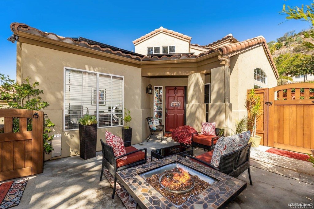 1840 Century Way Escondido, CA 92026 - Photo 2 of 36 a view of a two couches chair and fire pit in the patio