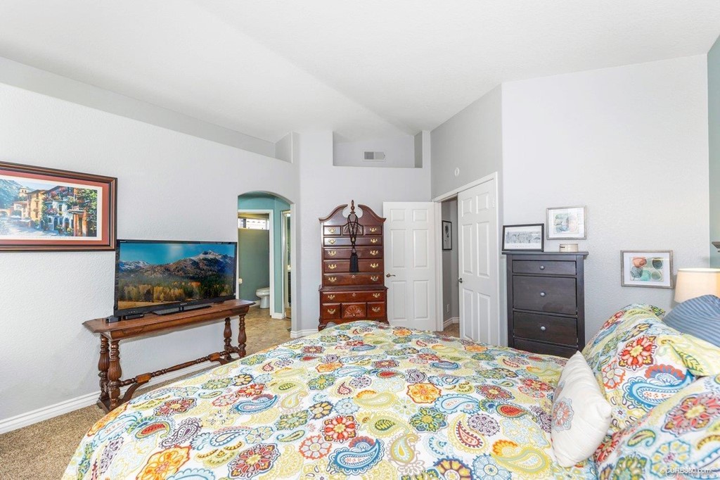 1840 Century Way Escondido, CA 92026 - Photo 23 of 36 a bedroom with a bed and a flat screen tv