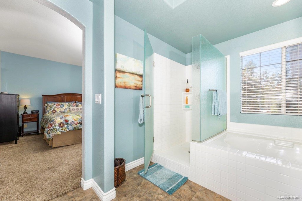 1840 Century Way Escondido, CA 92026 - Photo 25 of 36 a spacious bedroom with a bed and a window