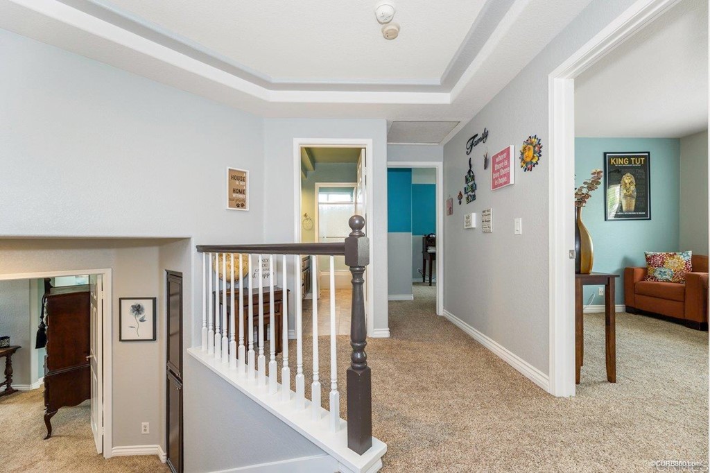 1840 Century Way Escondido, CA 92026 - Photo 27 of 36 a view of a hallway with workspace and a livingroom