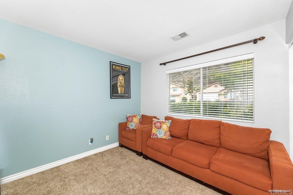 1840 Century Way Escondido, CA 92026 - Photo 29 of 36 a living room with furniture and a window