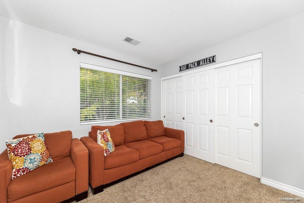 1840 Century Way Escondido, CA 92026 - Photo 30 of 36 a living room with furniture and a window