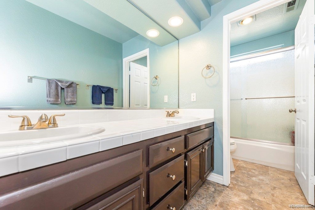 1840 Century Way Escondido, CA 92026 - Photo 32 of 36 a bathroom with a sink and a mirror