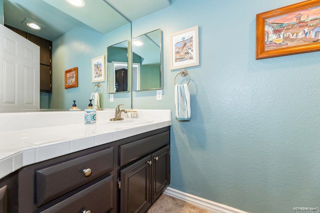 1840 Century Way Escondido, CA 92026 - Photo 34 of 36 a bathroom with a sink and a mirror