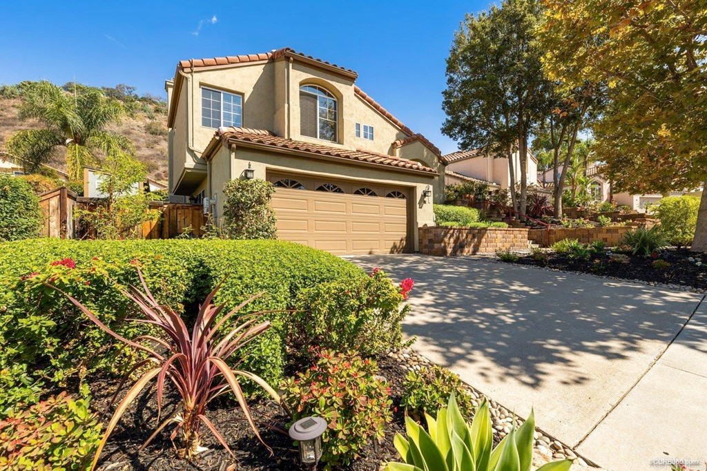 1840 Century Way Escondido, CA 92026 - Photo 36 of 36 a front view of a house with a yard and garage