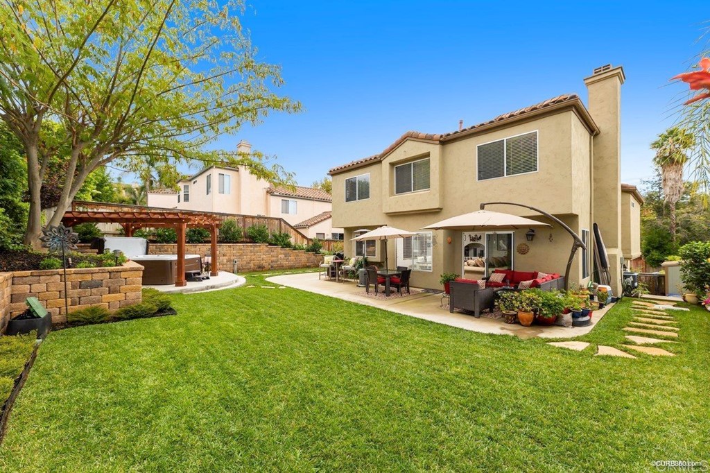1840 Century Way Escondido, CA 92026 - Photo 9 of 36 a view of a house with backyard sitting area and garden