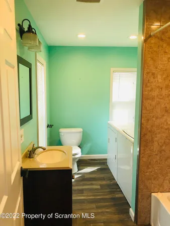 a view of a door and chair in a room