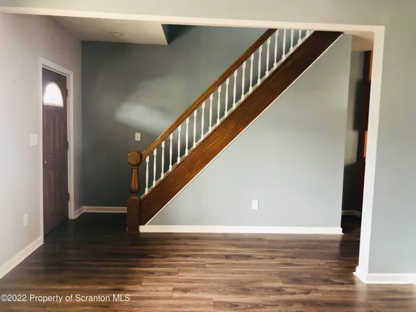 a view of entryway with wooden floor