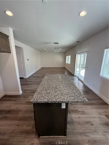 a view of room with wooden floor