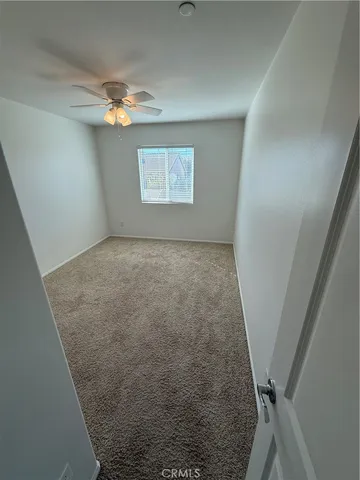 wooden floor in an empty room with a mirror