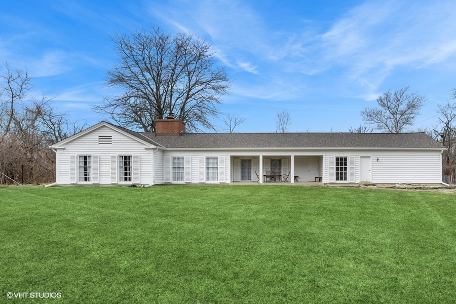 401 Lee Road Northbrook, IL 60062 - Photo 3 of 15 a front view of a house with a garden