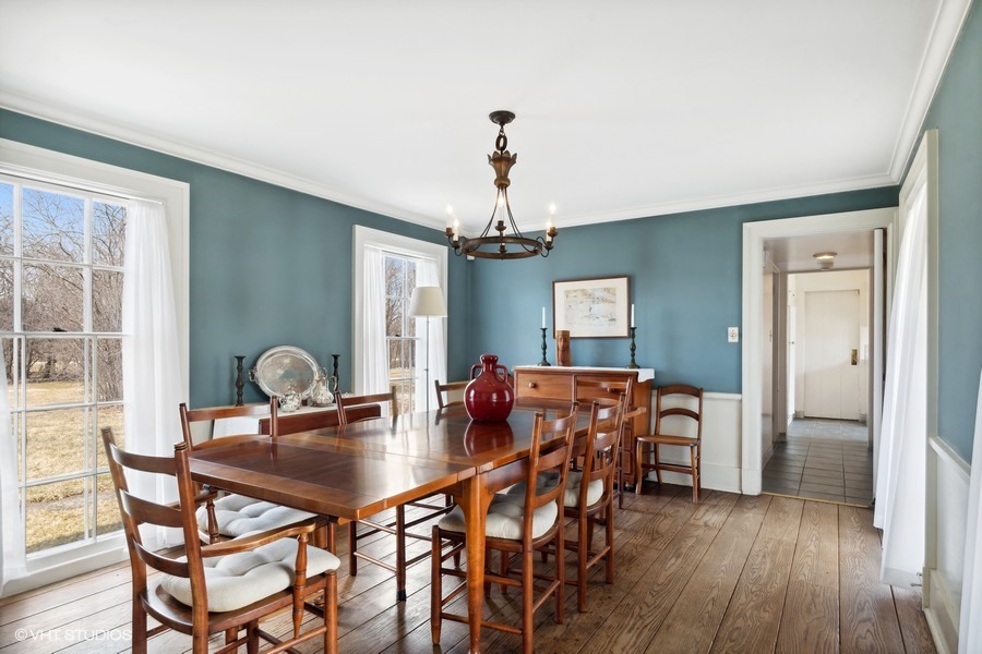 401 Lee Road Northbrook, IL 60062 - Photo 6 of 15 a dining room with furniture chandelier and wooden floor