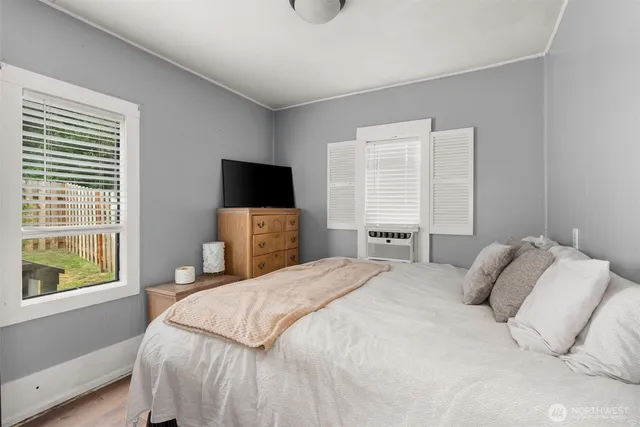 a bedroom with a bed and tv