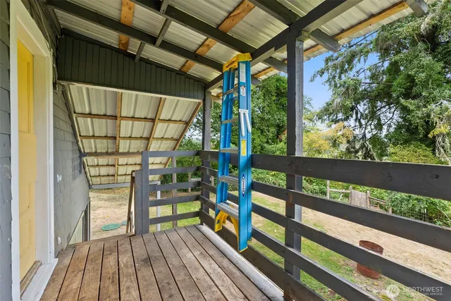 a view of a balcony with wooden floor