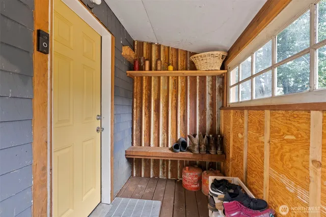 a view of balcony with furniture and wooden floor