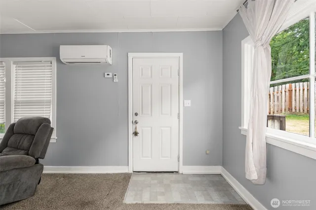 a view of livingroom with furniture and windows