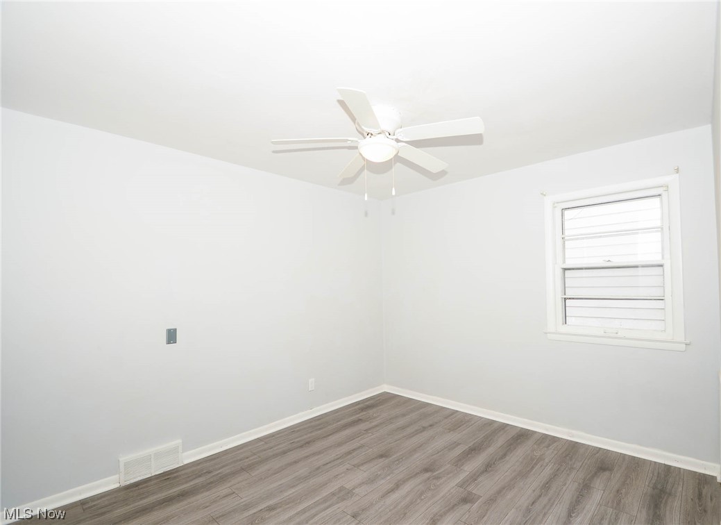 24599 Chardon Road Cleveland, OH 44143 - Photo 16 of 28 Unfurnished room featuring hardwood / wood-style floors and ceiling fan