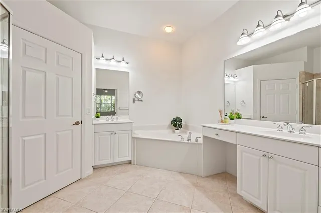 a bathroom with a sink mirror and toilet