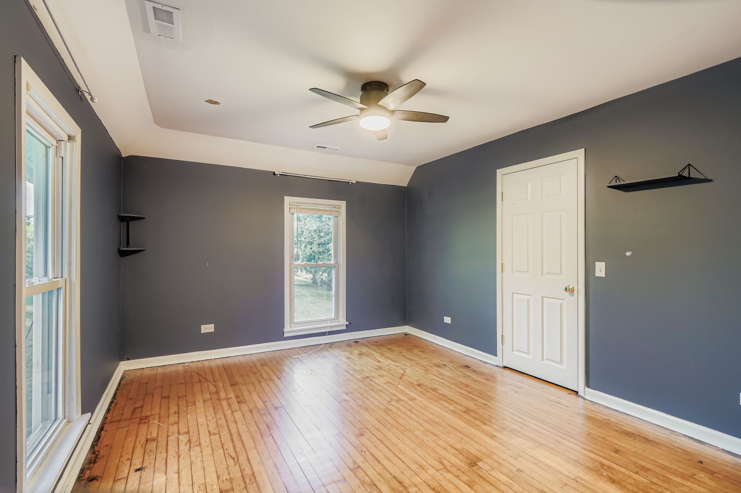 5N460 Hanson Road St. Charles, IL 60175 - Photo 11 of 24 an empty room with wooden floor and windows