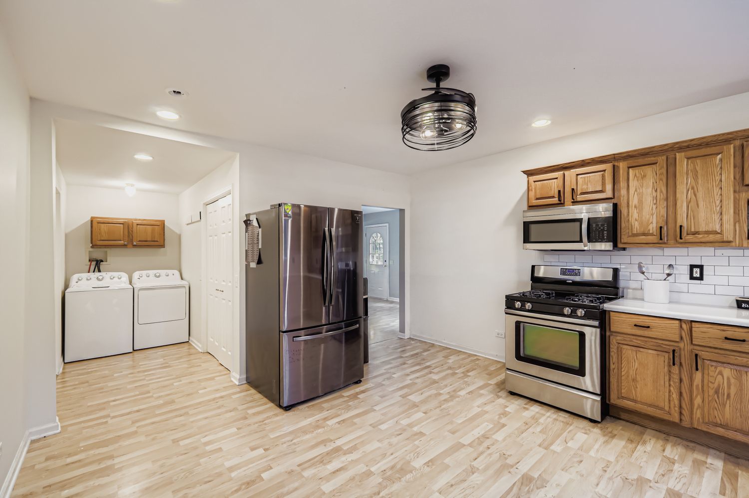 5N460 Hanson Road St. Charles, IL 60175 - Photo 8 of 24 a kitchen with a refrigerator cabinets and wooden floor