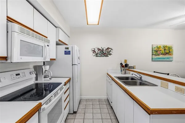 a kitchen that has a sink and a stove
