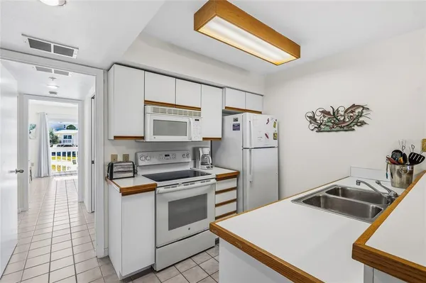 a kitchen that has a cabinets and a stove