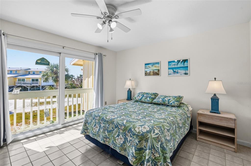 9400 Little Gasparilla, Unit F7 Placida, FL 33946 - Photo 14 of 39 a bedroom with a bed and a window