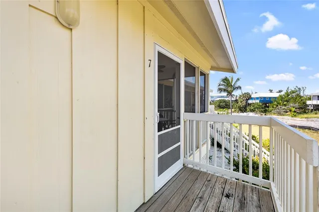 a view of balcony with wooden floor