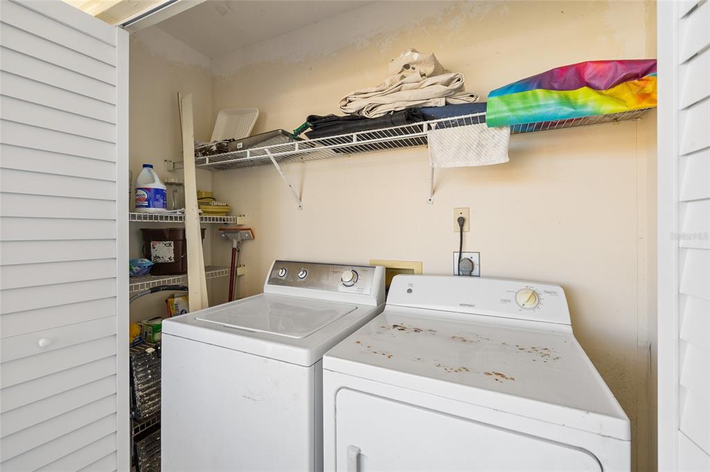 9400 Little Gasparilla, Unit F7 Placida, FL 33946 - Photo 27 of 39 a utility room with dryer and washer