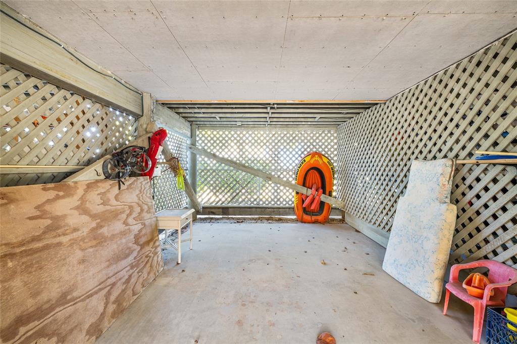 9400 Little Gasparilla, Unit F7 Placida, FL 33946 - Photo 29 of 39 a view of outdoor space with wooden wall