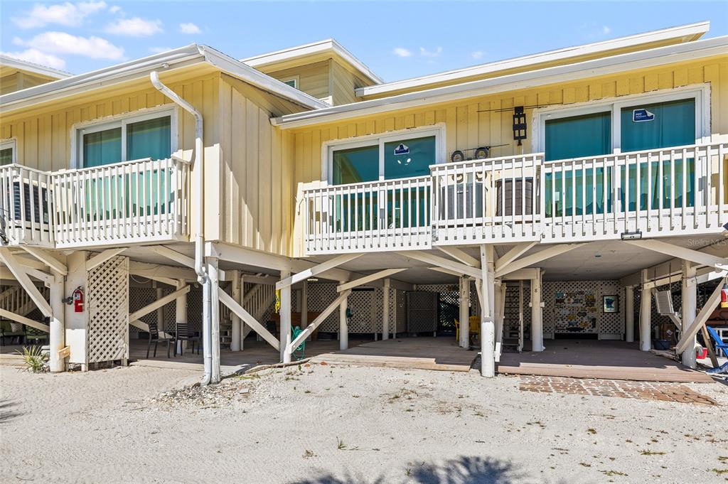 9400 Little Gasparilla, Unit F7 Placida, FL 33946 - Photo 33 of 39 a front view of a house with a yard