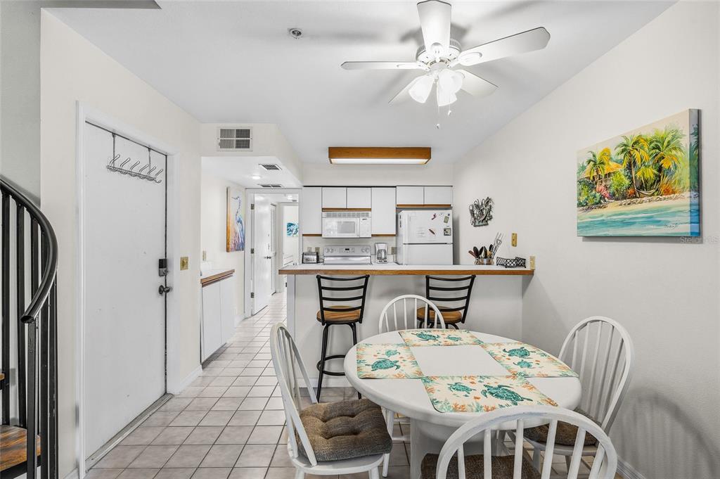 9400 Little Gasparilla, Unit F7 Placida, FL 33946 - Photo 5 of 39 a dining room with furniture and window